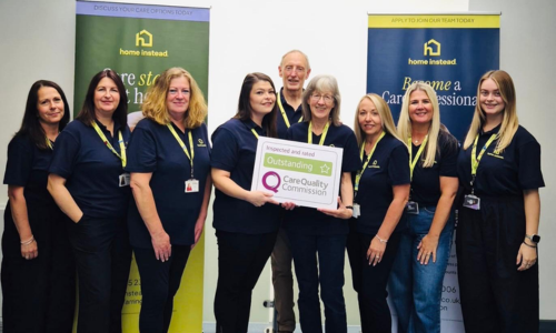 Home Instead team holding CQC outstanding rating