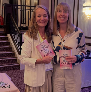Clare Jefferies holding her new book